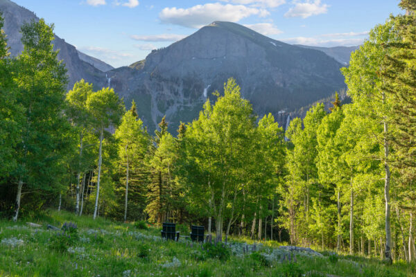 Meadow with wildflowers, privacy perimeter of Aspen with view of Ingram Falls, between Ajax Peak and Ingram Mountain, and Bridal Veil Falls